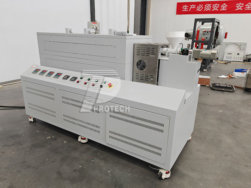 Actual photo of the rotating tube furnace with three temperature zones for the special material hopper